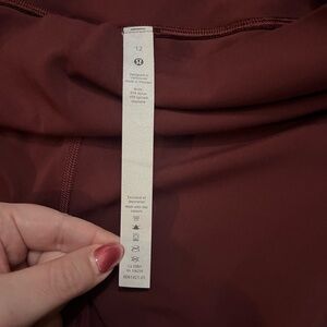 Lululemon size 12 maroon leggings with pockets and 23” inseam